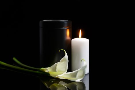 calla lily, candle and urn