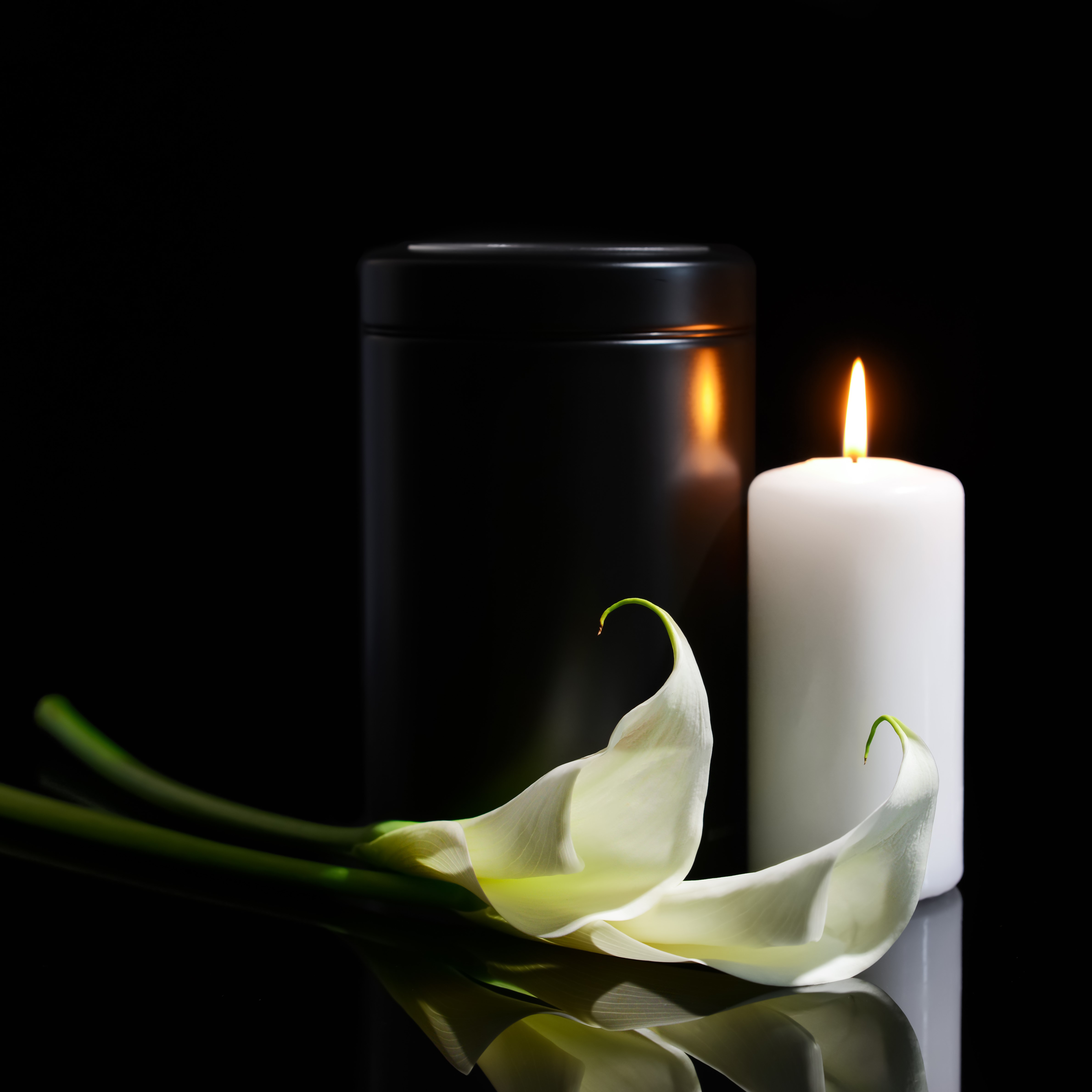 calla lily, candle and urn